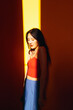 © Pansfun Images/Stocksy - Portrait of sunlight beam on fashion female face