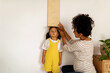 © Valentina Barreto/Stocksy - Measurements of a kid's height on the wall