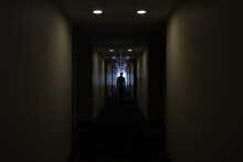 Man In A Hotel Corridor