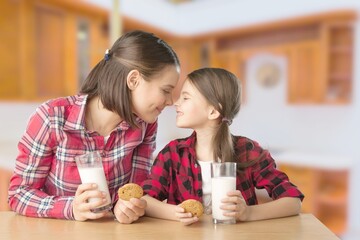 Sticker - Healthy Breakfast. Cute Little Girl And Her Smiling mother Eating Homemade Cookies