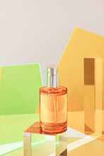 Unbranded Perfume Bottle On Glass Podium