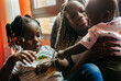 © Marco Govel/Stocksy - Young girl with her baby brother