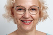 © Aleksandra Jankovic/Stocksy - Close Up Portrait Of Smiling Middle Aged Blond Woman