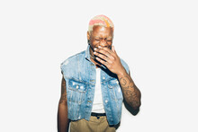 Cheerful Punk Man Laughing And Covering His Mouth 