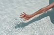 © Simone Wave/Stocksy - Hand touch water