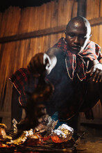 Masai Man Cooking.