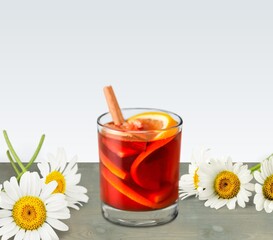 Poster - Chamomile tea in a mug with natural small chamomile flowers