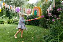 A Birthday Girl In The Garden  With Pinata