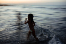 Motion Image Of Kid In The Beach