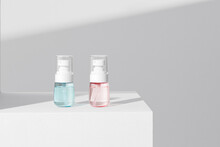Serum Cosmetic Bottle With Pump On White Podium On White Background