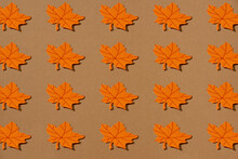 Seamless Pattern With Autumn Leaves On Orange Background