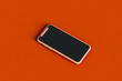 © Giada Canu/Stocksy - a smartphone on red background