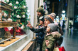 © Daniel Gonzalez/Stocksy - A family shopping for christmas