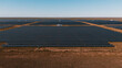 © Yakov Knyazev/Stocksy - wide aerial shot of photovoltaic panels