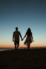 Silhouette Of A Couple On The Beach