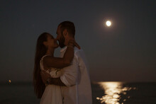 Couple Kissing In The Moonlight