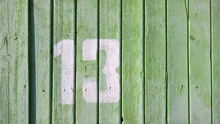 Rustic Style Green Wooden Background. Background Texture Of An Old Tree. Abstract Background In Light Green Tones, Empty Template. The View From The Top. The Old Wooden Table Is Green. Number 13