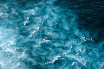  Aerial view to seething waves with foam. Waves of the sea meet each other during high tide and low tide