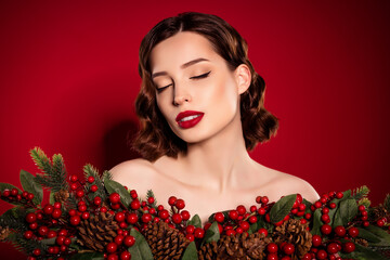 Wall Mural - Photo of tender female model christmas preparation fancy lady chic make up isolated on red color background