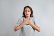© New Africa - Mature woman suffering from breathing problem on light background