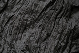 Fototapeta Desenie - Empty black background with wrinkle texture, copy space