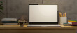 © bongkarn - Working space with laptop computer blank screen mockup on wooden table over cement wall