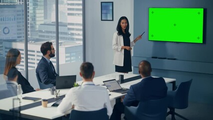 Leinwandbilder - Diverse Office Conference Room Meeting: Asian Female Project Manager Uses Green Screen Chroma Key Wall TV to Present Digital Investment Opportunity for Happy Investment Team. Static Wide Shot