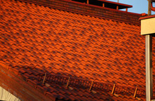 Brightly Lit Red Tiles Roof For Background