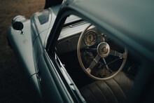 Oldtimer Car Dashboard. Retro Car Interior. Old Steering Wheel Detail.