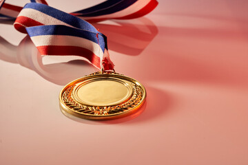 gold medal on pink background
