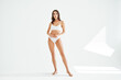 © GVS - Full length portrait of sporty beautiful woman with slim body in white underwear
