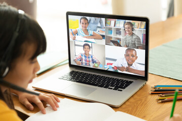 Sticker - Asian girl using laptop for video call, with smiling diverse high school pupils on screen