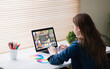 © vectorfusionart - Caucasian woman using laptop for video call, with smiling diverse elementary school pupils on screen