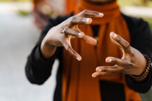 Close-up Hands Of Black Muslim Woman At Qigong Chinese Meditation And Sport Training Outdoor. African Girl Is Meditating Outdoor Near Chinese Arbor.