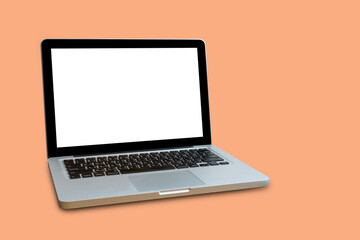 Laptop with blank screen on circle wooden table with mouse, a cup of coffee, notebook and pen, isolated on white.