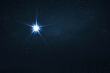 Wall Mural - the star shines over the manger of christmas of jesus christ. bethlehem illuminated by christ's chri