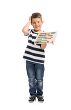 Cute Little Boy With Abacus On White Background