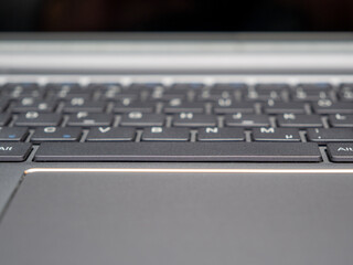 Poster - Closeup shot of a notebook keyboard and the touchpa