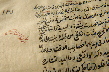 Sticker - Ancient open book in arabic. Old arabic manuscripts and texts