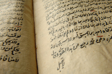 Sticker - Ancient open book in arabic. Old arabic manuscripts and texts