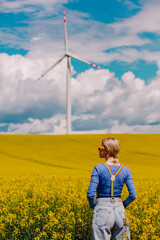 Sticker - Beautiful female in rainbow LGBT suspenders for pants in rapeseed field