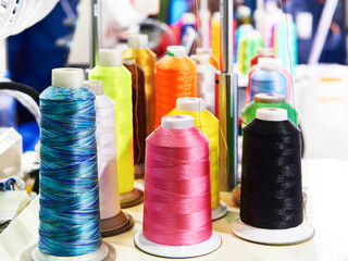 Wall Mural - Bobbins with colored thread for industrial textile