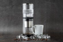 Modern Cold Brew Drip Tower Coffee Maker On Dark Stone Background