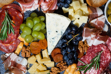  assorted cheeses, fruits and meats, top view