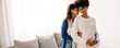 © (JLco) Julia Amaral - Expectant lesbian couple bonding at home