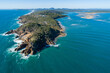 © Austockphoto - Aerial image of Round Hill headland and the Town of 1770, with Agnes Water in the background