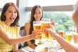 © Tom Wang - Happy Young group enjoying food and drink in restaurant