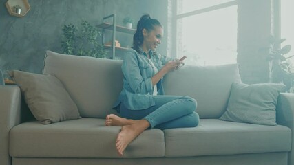 Canvas Print - Positive nice cute lady sit cozy sofa texting friends telephone remote chat