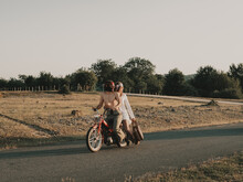Hippie Couple Riding On Moped