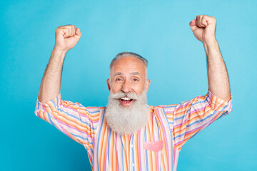 Sticker - Photo of senior man happy positive smile celebrate victory hooray fan champion isolated over blue color background